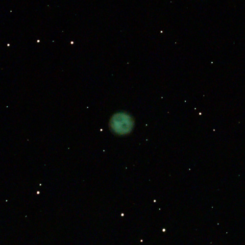 Photo of Messier 97 Owl Nebula through a Seestar S50 telescope under Bortle 7 skies in suburban Seattle. Exposure 16 minutes with a half moon near by. Also known as M97, NGC 3587, ARO 25.