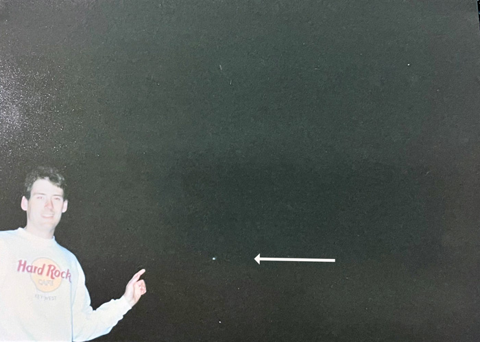 Photo of Wayne McGraw pointing toward Comet Hale-Bopp on March 20, 1997.