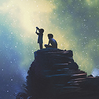 Photo of two boys looking at the stars.