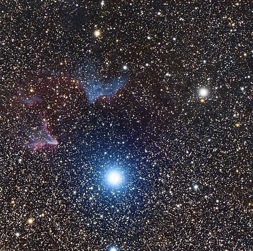 Blue-white star of Navi, also known as Gamma Cassiopeiae, lighting up nearby IC 63 Ghost Nebula.