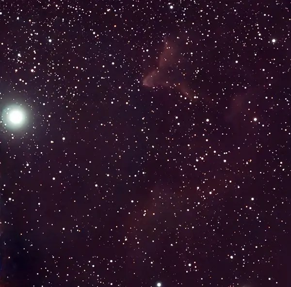 Shows the star Navi (Gamma Cassiopeiae) with nearby IC 63 Ghost Nebula taken with Seestar S50 over 83 minutes of exposure.