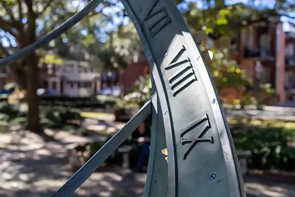 Show Roman Numerals on Savannah Armillary Sphere with sunlight and shadow.