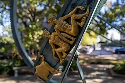 Shows a close-up of the Armillary Sphere in Savannah with gold zodiac characters.