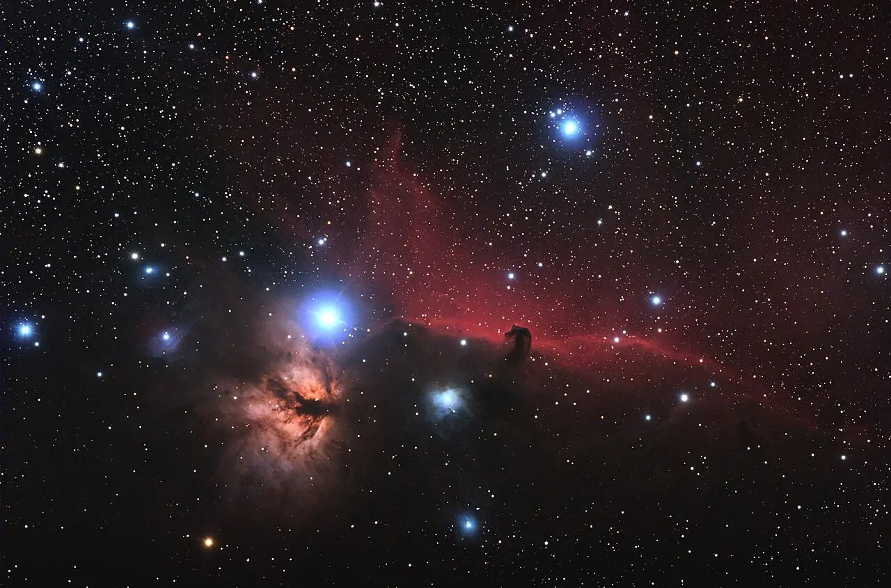 Features both the Horsehead and Flame Nebula in one color picture