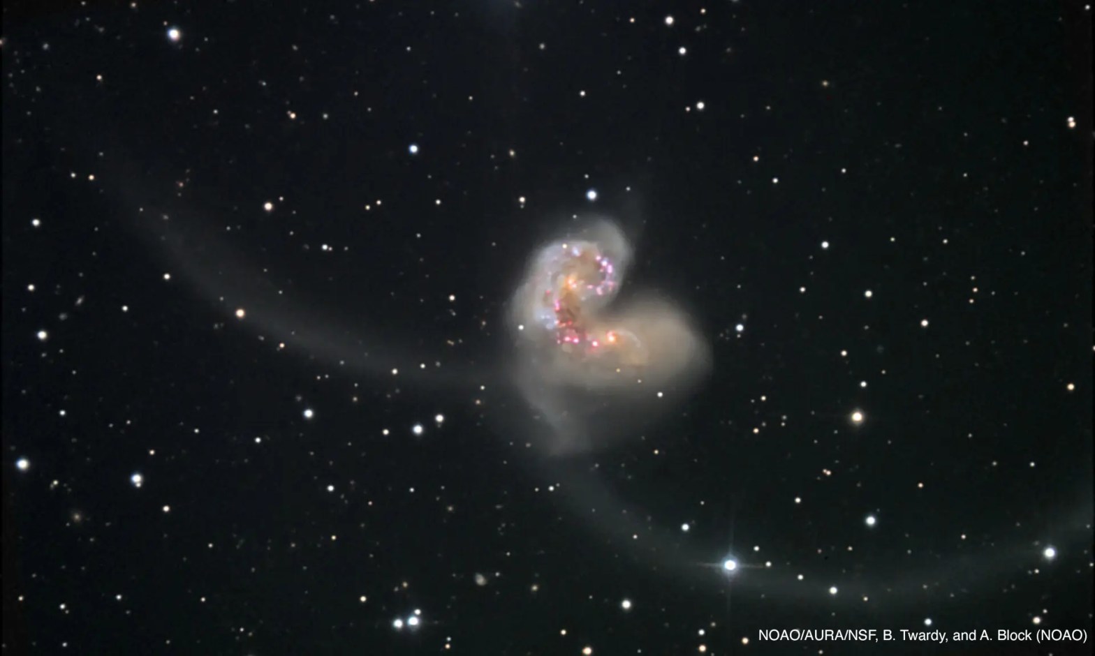 Photo of the antennae galaxies with their tidal tails.